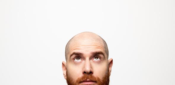 Bald young man, front view 