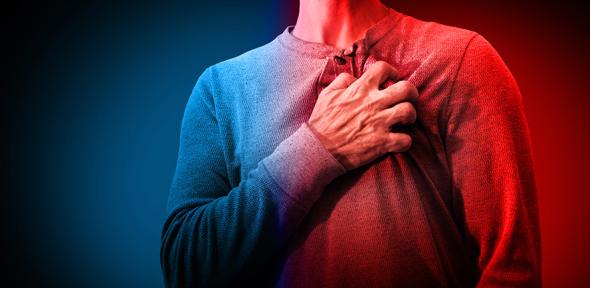 Person clutching their chest in pain
