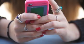 Teenager holding a smartphone